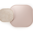 Poppy side table in natural travertine with characteristic holes and pits – theMADgroup