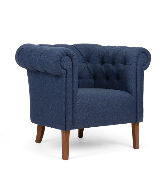 Chesterfield lounge chair with tufted detailing and timeless design | theMADgroup