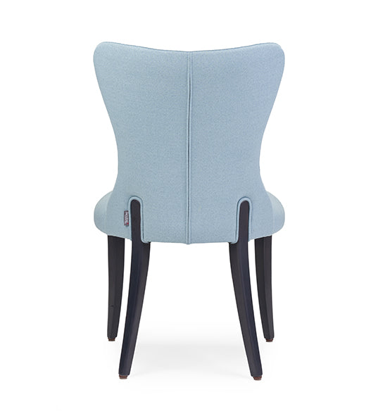 Flower 01 CB armchair with elegant curves and grounded presence | theMADgroup