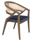 Rory Chair with woven cane back and deep-toned cushion | theMADgroup