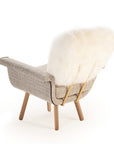 Ivy Armchair with white lamb leather back, wire 02 seat, Paris black piping, and natural oak feet – theMADgroup
