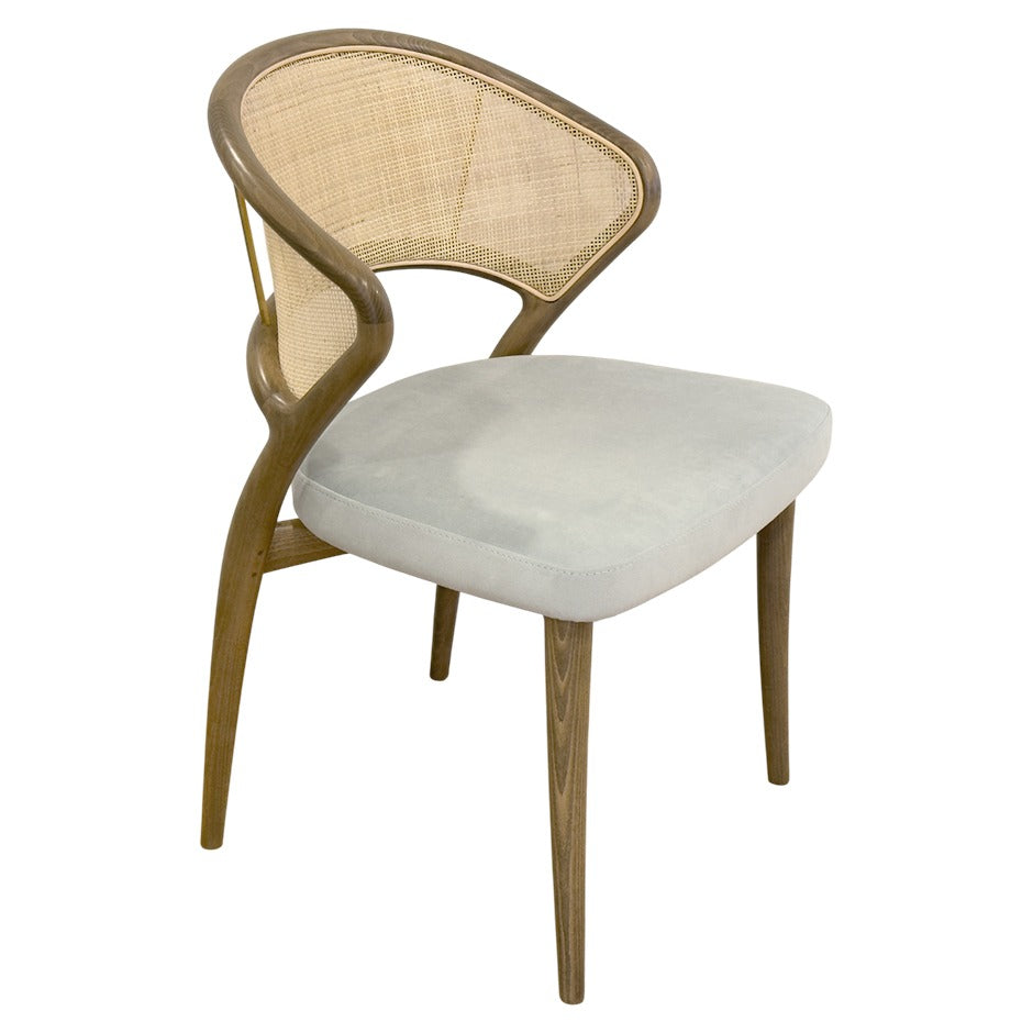 Aura chair with curved wood frame and rattan back | theMADgroup