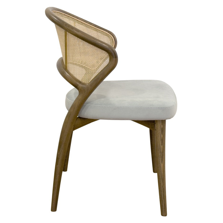 Aura chair with curved wood frame and rattan back | theMADgroup