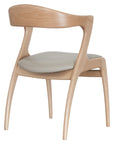 Gazelle Chair with sculpted wooden frame and sweeping curved arms | theMADgroup