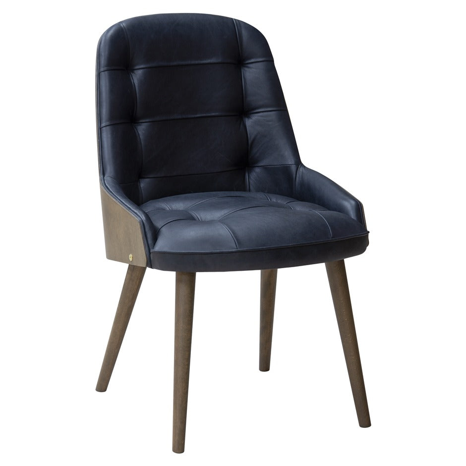 Newton Deluxe Chair with tufted upholstery and wooden legs | theMADgroup