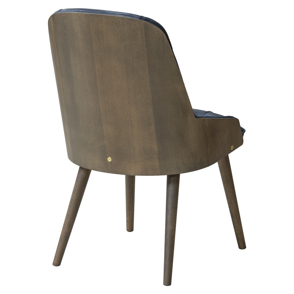Newton Deluxe Chair with tufted upholstery and wooden legs | theMADgroup