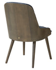 Newton Deluxe Chair with tufted upholstery and wooden legs | theMADgroup