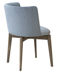 Novara 2B Chair with curved upholstered back and wooden legs | theMADgroup