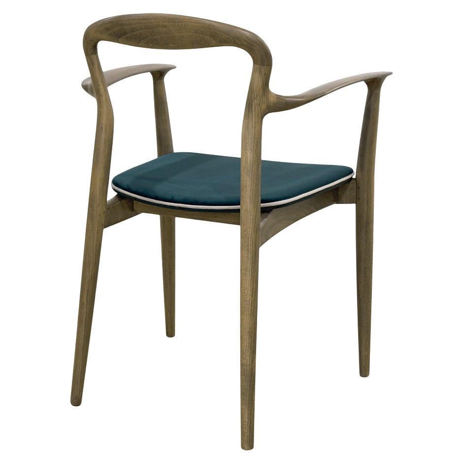 Verona B Chair with sculpted wooden frame and curved arms| theMADgroup