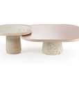 Poppy side table in natural travertine with characteristic holes and pits – theMADgroup
