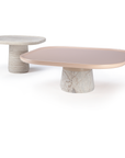 Poppy side table in natural travertine with characteristic holes and pits – theMADgroup