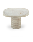 Poppy side table in natural travertine with characteristic holes and pits – theMADgroup